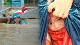 Người đàn ông kéo thuyền đi nhận hàng cứu trợ cho gia đình 7 người và những hình ảnh xót xa không thể nào quên nơi “rốn lũ”