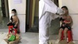 Bé trai 6 tuổi một mình đi nhận kết quả dương tính Covid-19: Ánh mắt ngơ ngác, ngồi nép vào cánh cửa